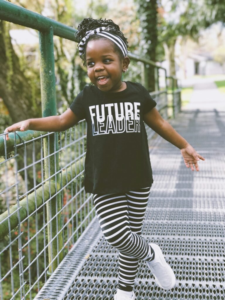 young girl with future leader shirt